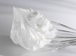 Beaten egg white on whisk
