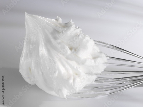 Photo: Beaten egg white on whisk Beaten egg white on whisk