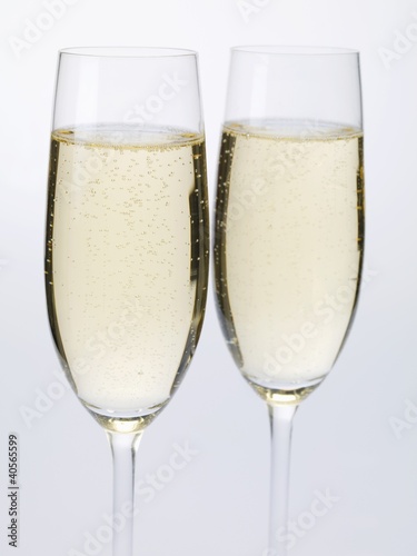 Photo: Two glasses of sparkling wine side by side Two glasses of sparkling wine side by side
