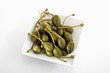 Giant capers in square dish