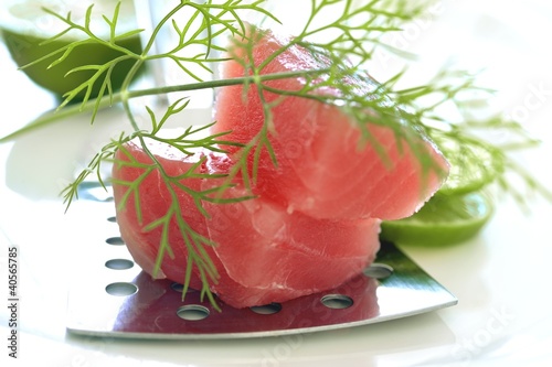 Photo: Fresh tuna fillet with slices of lime Fresh tuna fillet with slices of lime