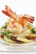 Fried prawns on potato, asparagus and ham salad