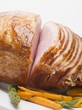 Glazed roast ham with carrots and asparagus
