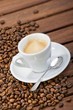 Cup of espresso and coffee beans