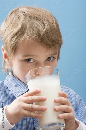 Photo: Little boy drinking milk Little boy drinking milk