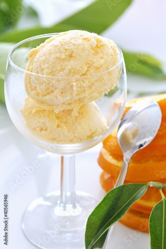 Photo: Two scoops of orange ice cream in a glass Two scoops of orange ice cream in a glass