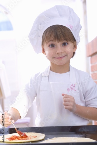 Photo: Girl making pizza Girl making pizza