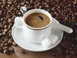 A cup of espresso and coffee beans