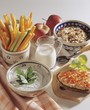 Muesli, vegetable sticks and dips for breakfast
