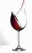 Pouring red wine into a glass