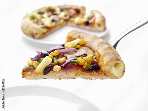 Photo: Ham and vegetable pizza with cheese-filled crust Ham and vegetable pizza with cheese-filled crust
