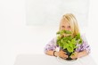 Girl with a pot of basil