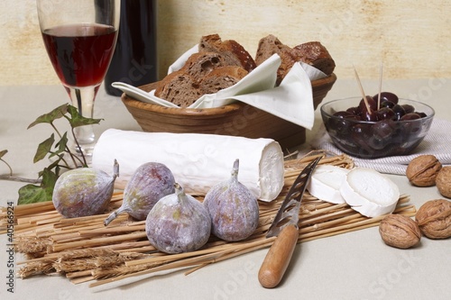 Photo: Goats' cheese log with figs, nuts, olives, bread & red wine Goats' cheese log with figs, nuts, olives, bread & red wine