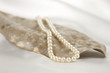 Pearl necklace on leaf