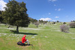 Foto: Red dressed hiker resting Red dressed hiker resting