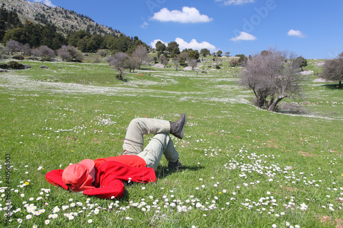 Foto: Red dressed person on a meadow Red dressed person on a meadow