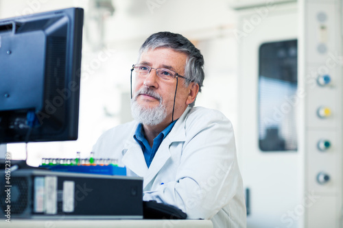 Photo: Senior researche using a computer in the lab Senior researche using a computer in the lab