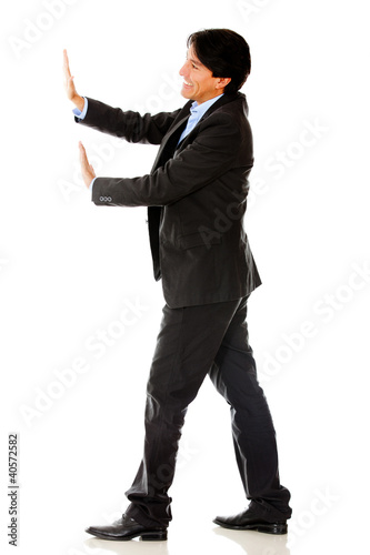 Photo: Business man pushing Business man pushing