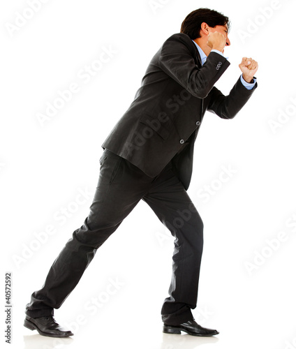 Foto: Business man pulling a rope Business man pulling a rope