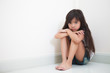 Little girl looks sad to camera
