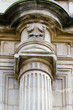 Detail of an ancient Greek pillar of ionic order ,facade of the Detail of an ancient Greek pillar of ionic order ,facade of the