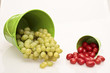 Tomatoes and grapes in a green bucket Tomatoes and grapes in a green bucket