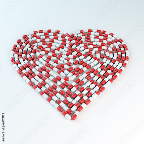 Illustration: Red and white capsules forming a heart shap Red and white capsules forming a heart shap