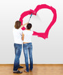Illustrazione: Young couple with paint brushes Young couple with paint brushes