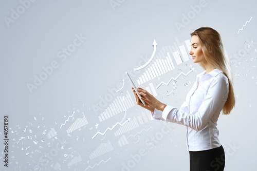 Photo: Woman in business wear with technology background Woman in business wear with technology background