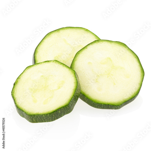 Photo: Sliced zucchini on white, clipping path included Sliced zucchini on white, clipping path included