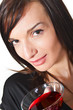 Young woman with wine in glass. Young woman with wine in glass.