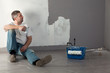 Man painting a wall.