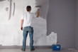 Man painting a wall. Man painting a wall.