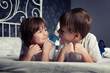 Photo: Brother and sister on bed Brother and sister on bed