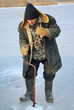 Old man on winter fishing 2