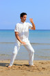man on the beach meditating