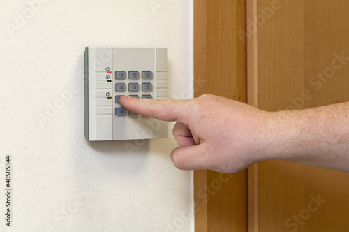 Photo: man enters the code access man enters the code access