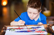 Boy painting a batik Boy painting a batik