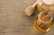 jar and pot of honey with stick on wood jar and pot of honey with stick on wood