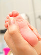 Massaging infant foot