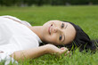 Woman laying on grass