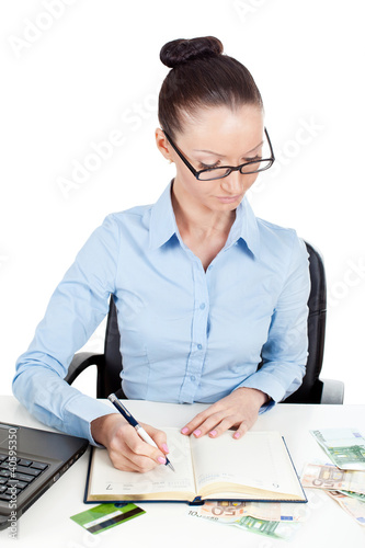 Foto: Business woman at office desk Business woman at office desk