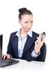 Upset business woman looking on the phone