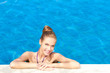 Cute in swimming pool with copy space