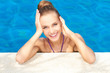 Cute in swimming pool with copy space