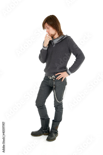 Photo: Thoughtful man looking down with silly expression Thoughtful man looking down with silly expression