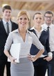 business woman standing with her staff at conference