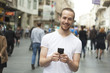 Smiling Man with cell phone walking Smiling Man with cell phone walking