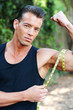 Photo: Muscular man measuring bicep Muscular man measuring bicep