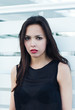 portrait of a beautiful brunette woman in a black dress. portrait of a beautiful brunette woman in a black dress.